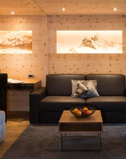 The living room with balcony, desk and sitting area