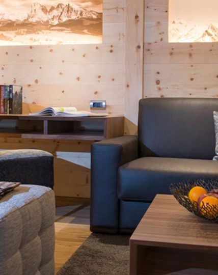 The furniture of the living room: the desk, couch, couch table and footstool