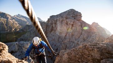 Someone is climbing on a via ferrata in the Dolomites