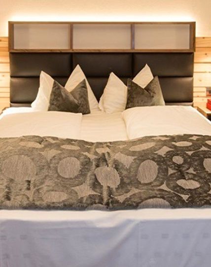 The bedroom with a king size bed and a fireplacea