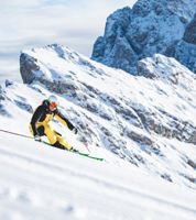 A skier is skiing in the Dolomites
